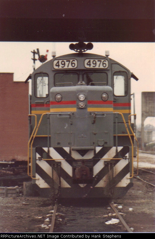 Front of the Opelika Switcher tied up in house track at Opelika.  Note te train order signal in the rear at the agency built into the end of the WofA freighthouse.
